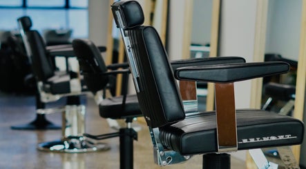 Modern barber chairs at Abōde, Sydney, New South Wales, AU, offering premium grooming services.