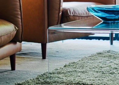 Elegant lounge setting with modern glass table at Abōde, Sydney, New South Wales, AU.