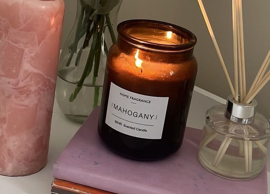 Elegant candles and diffuser set a calming mood at Fairy Lashes, Cape Town, Western Cape, ZA.