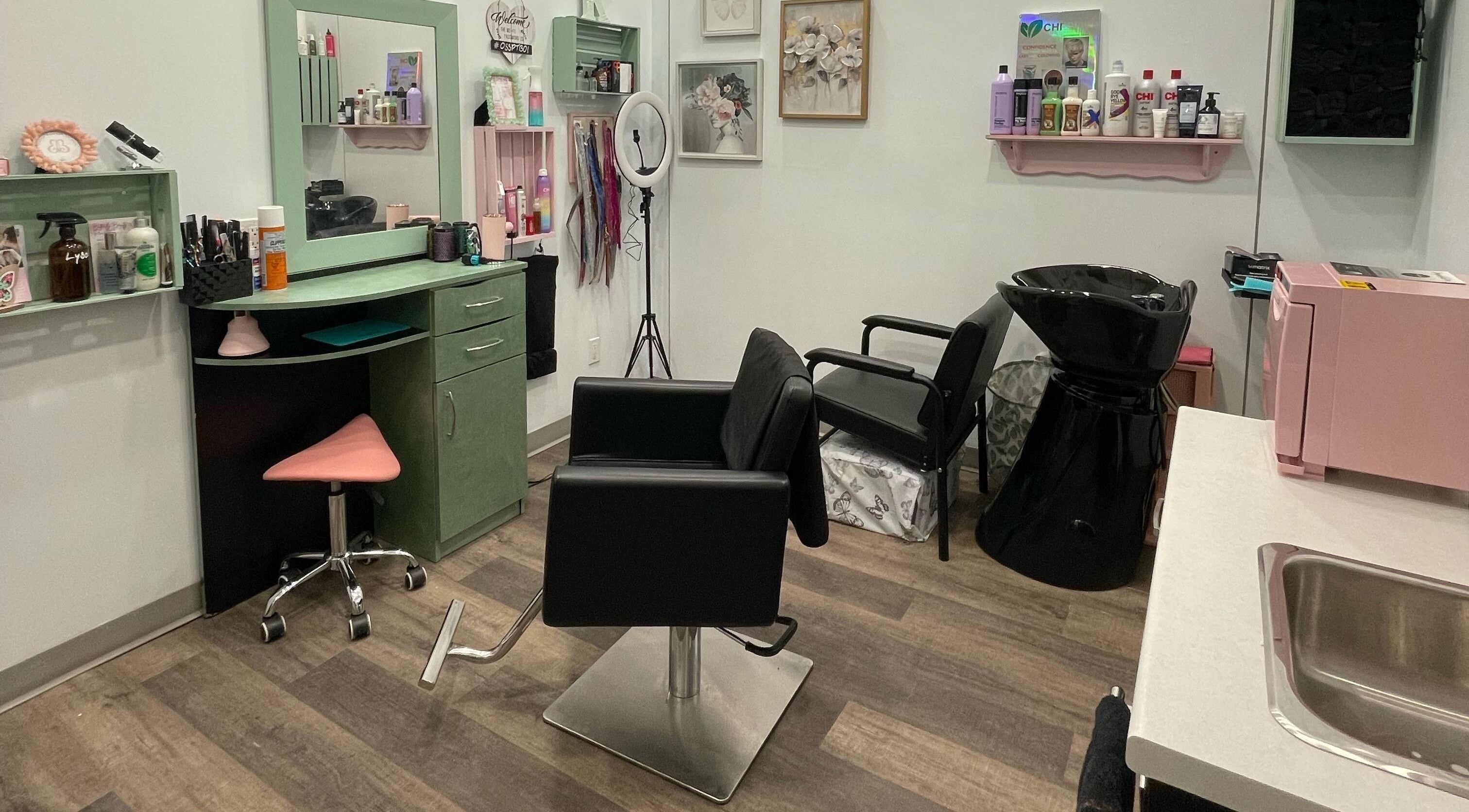 Interior of Butterfly Beauty Salon in Peterborough, Ontario, CA, featuring styling and washing stations.