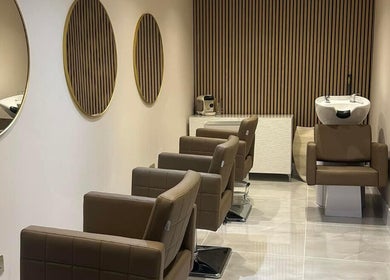 Modern salon chairs and mirrors at Hairworks, Newcastle upon Tyne, England, GB.