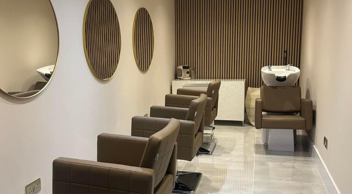 Modern salon chairs and mirrors at Hairworks, Newcastle upon Tyne, England, GB.