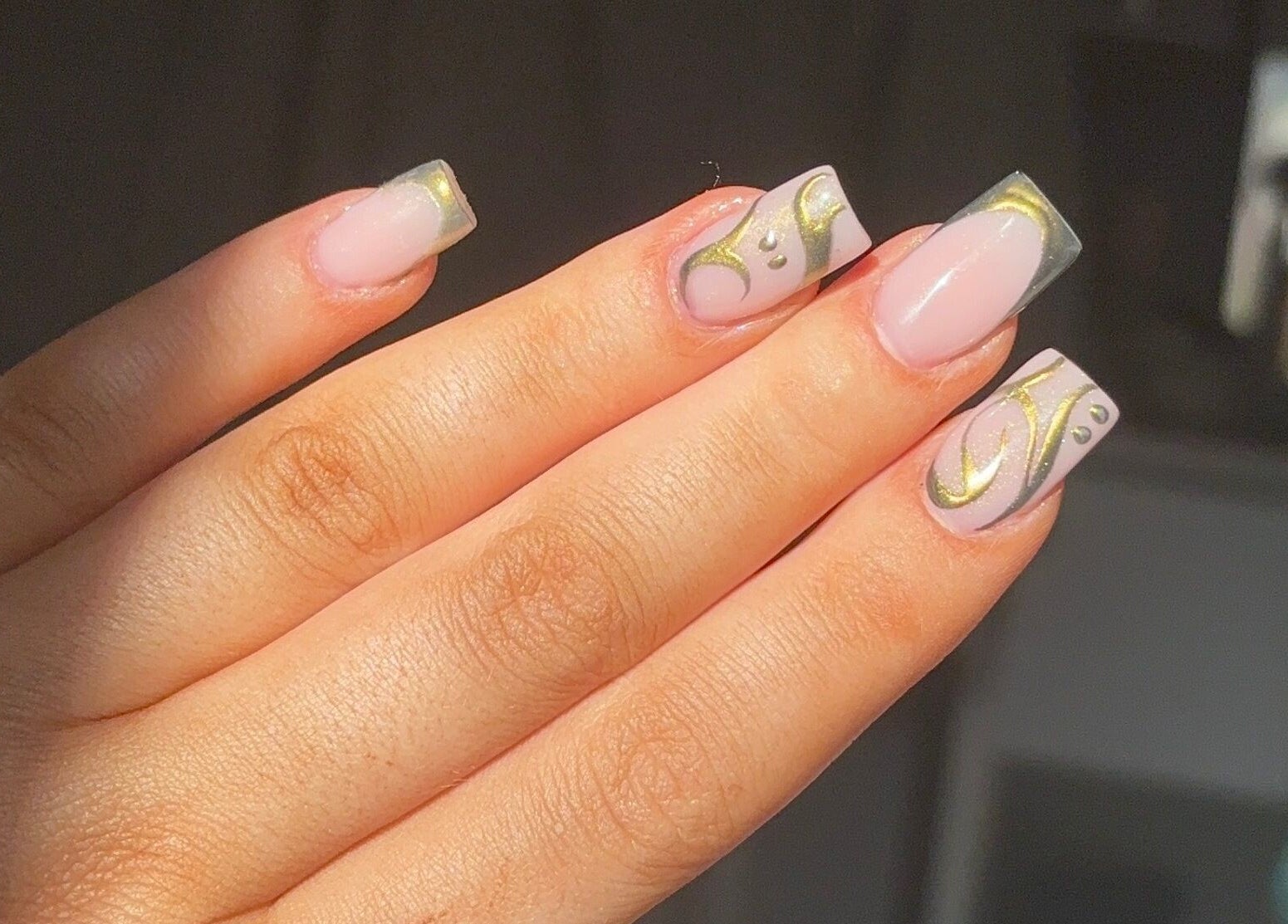 Elegant nail art with golden swirls by Nails by Lola, Royal Wootton Bassett, England, GB.