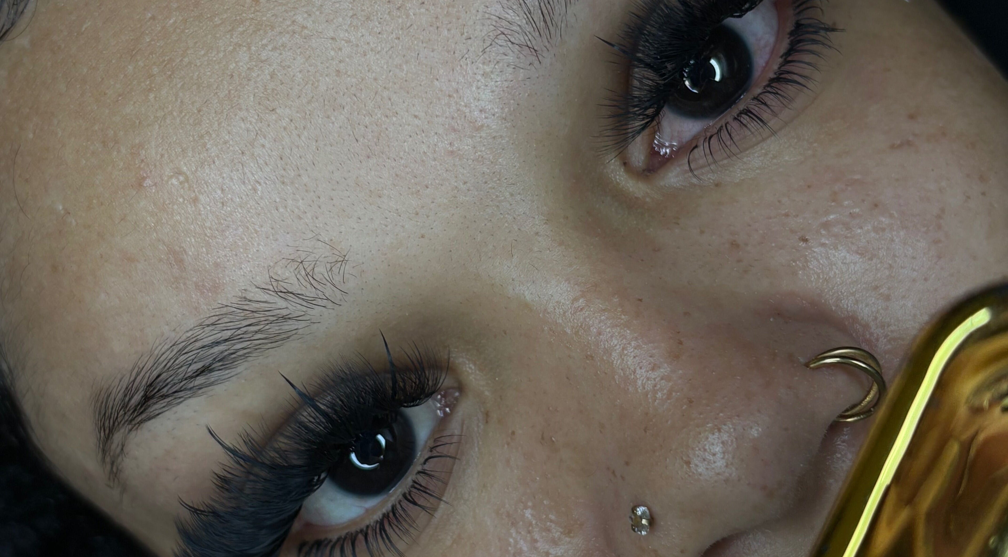 Close-up of styled lashes at PrettyPlease Studio, Bridgetown, Saint Michael, BB. Elegant and defined beauty look.