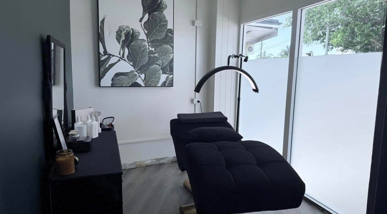 Relaxing spa room at L.A.H hair and beauty bar, Budgewoi, New South Wales, AU, featuring a cozy massage bed.