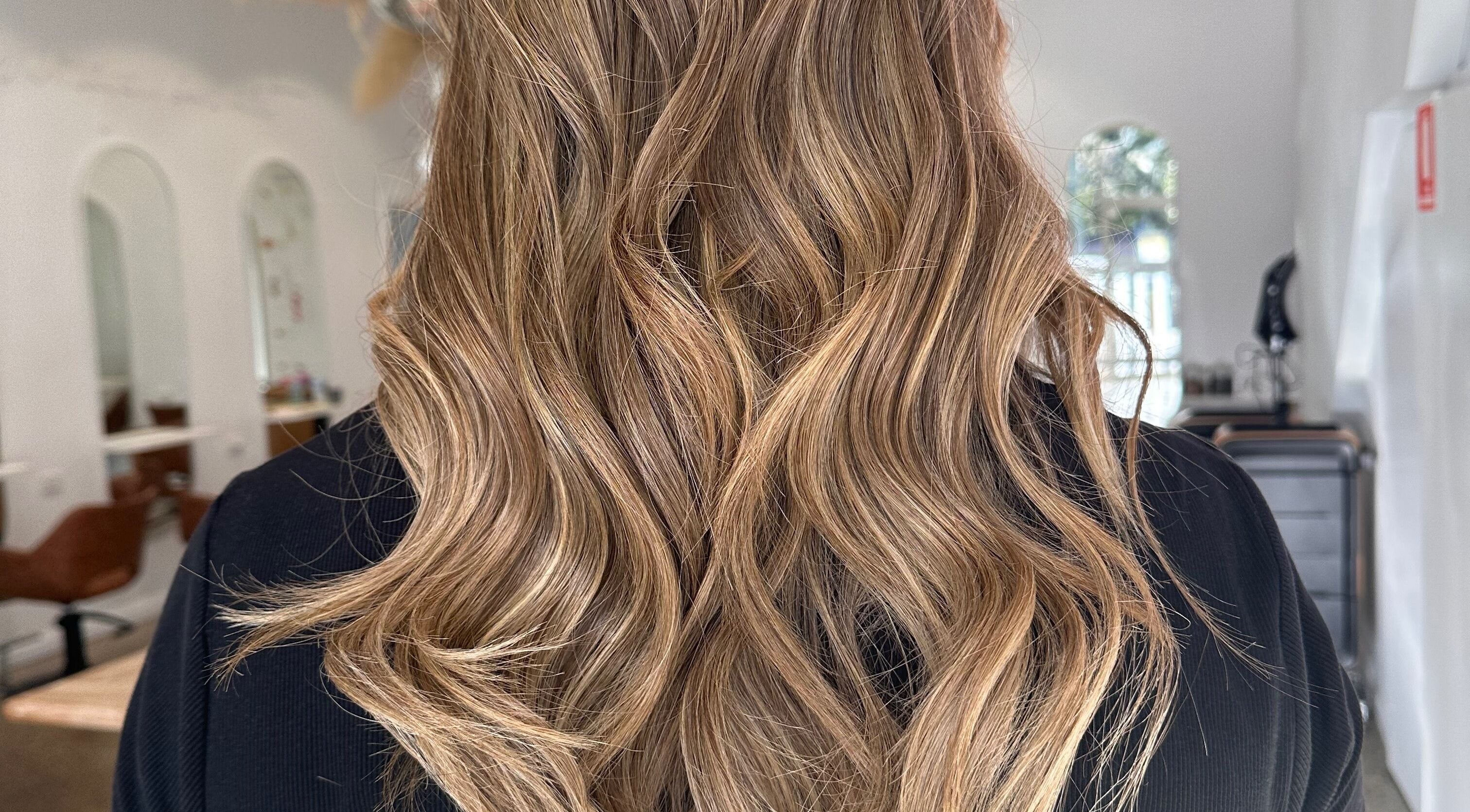 Lustrous golden wavy hairstyle at Hope at The Studio, Castle Hill, New South Wales, AU.