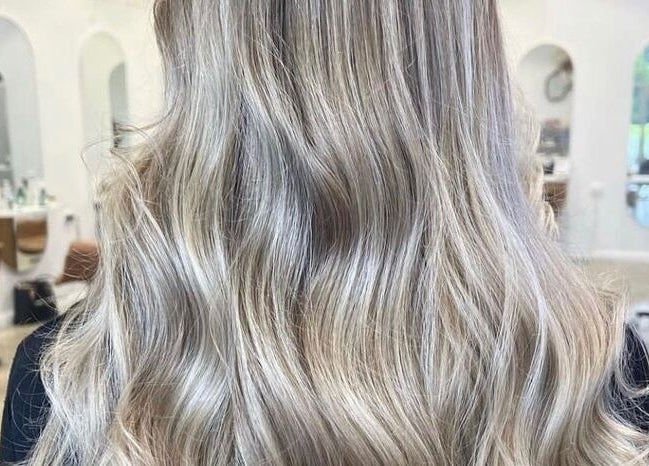 Blonde wavy hairstyle at Hope at The Studio, Castle Hill, New South Wales, AU, showcasing elegant beauty.