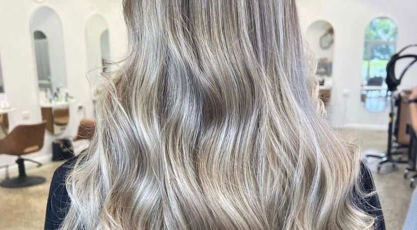 Blonde wavy hairstyle at Hope at The Studio, Castle Hill, New South Wales, AU, showcasing elegant beauty.
