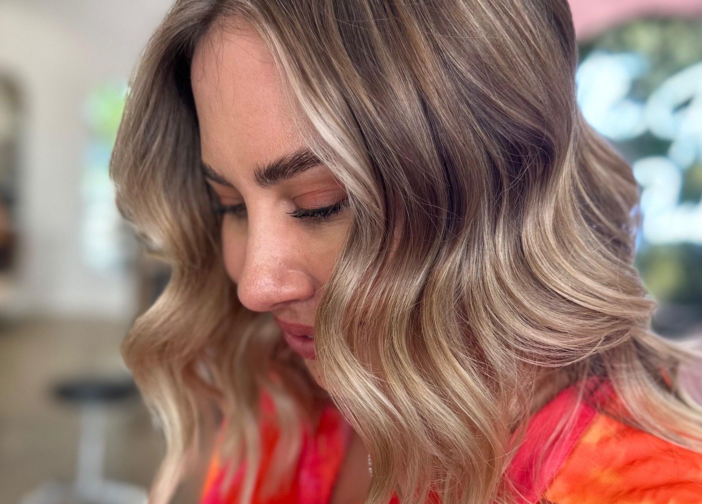 Close-up of stylish wavy blonde hair at Hope at The Studio, Castle Hill, New South Wales, AU.