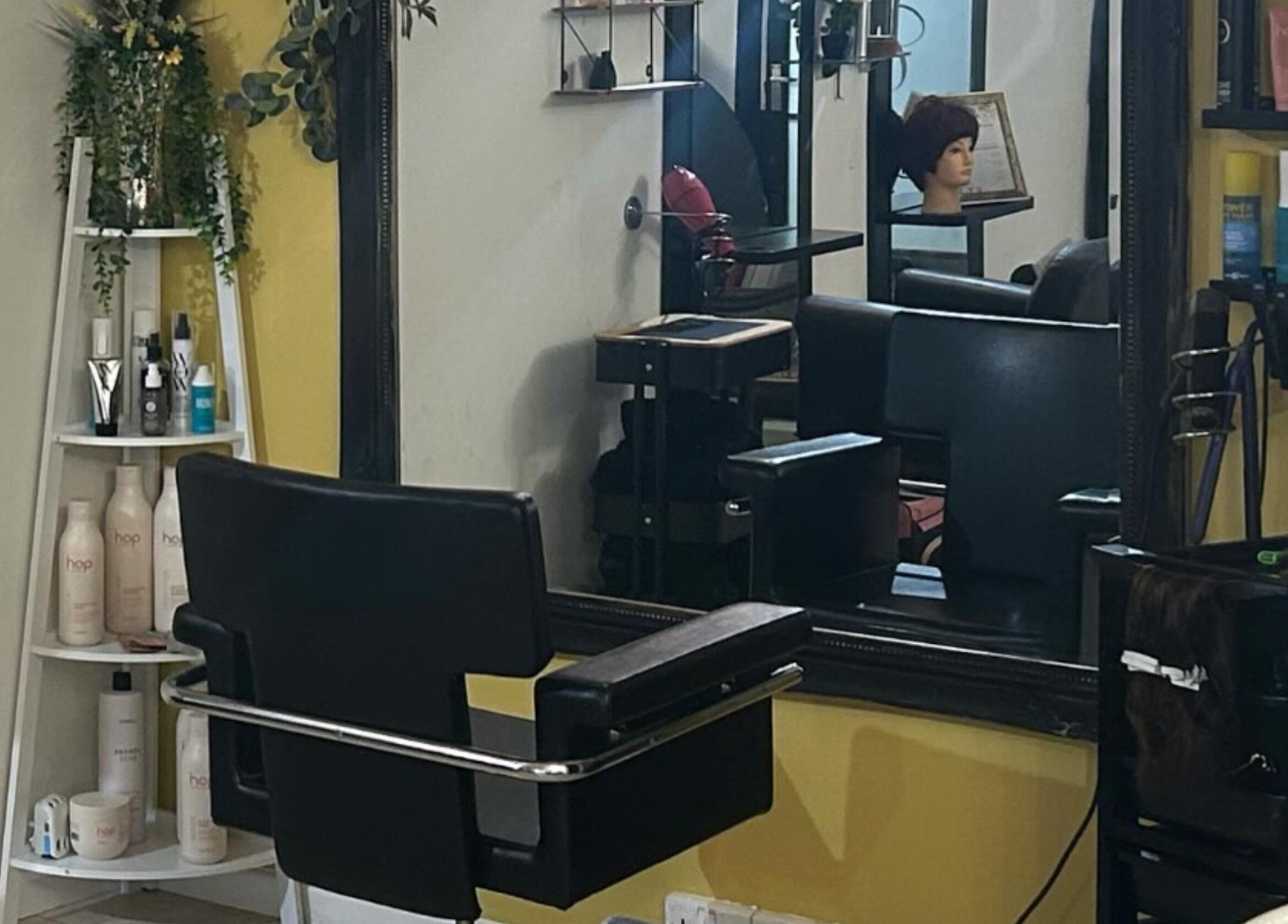 Chic hair styling station at BeeUnique, Northampton, England, GB, featuring modern decor and beauty products.