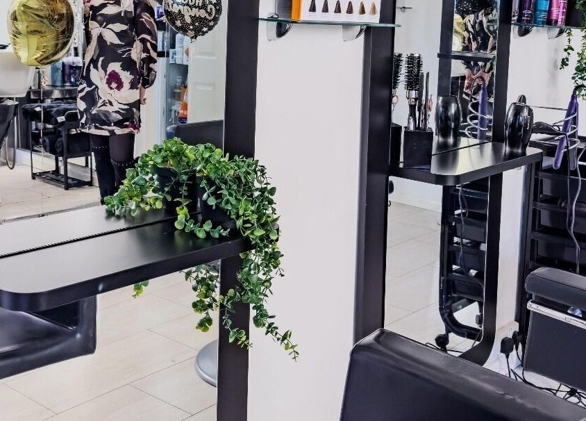 Stylish beauty workstation at BeeUnique, Northampton, England, GB with modern decor and professional styling tools.