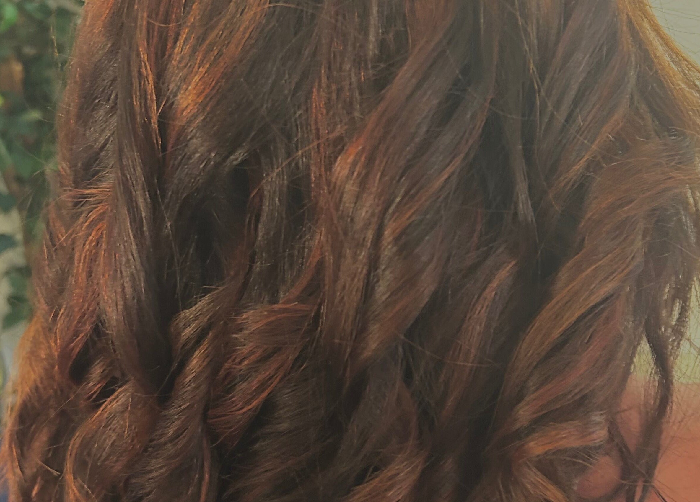 Stylish wavy brown hairstyle at BeeUnique, Northampton, England, GB, showcasing expert hair design.