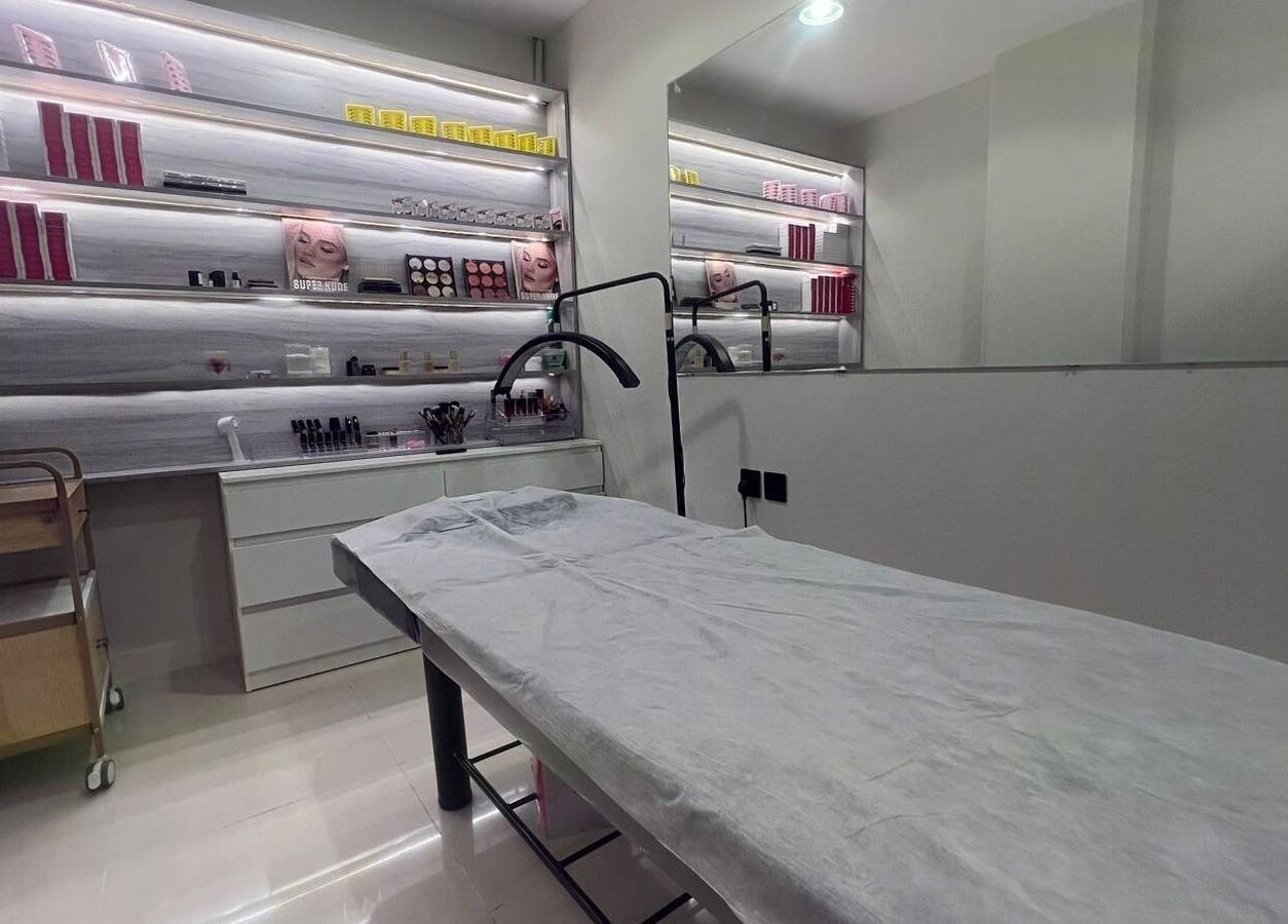 Luxurious treatment room at 3 Papillons Salon, Dammam, Eastern Province, SA, featuring modern decor and beauty products.