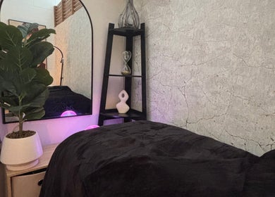 Calming therapy room at The Allure Body Contouring, Adelaide, South Australia, AU featuring a plush bed and decor.