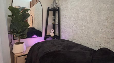 Calming therapy room at The Allure Body Contouring, Adelaide, South Australia, AU featuring a plush bed and decor.