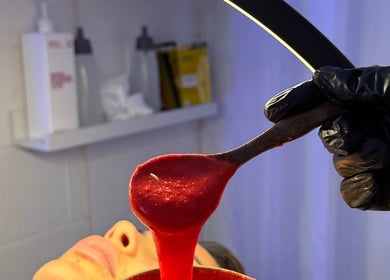 Facial treatment at The Allure Body Contouring in Adelaide, South Australia, AU, using a vibrant mask.