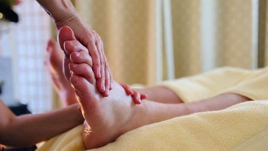 Relaxing foot massage at Marie Johnson Holistic Therapies in Crediton, England, GB. Experience soothing wellness.