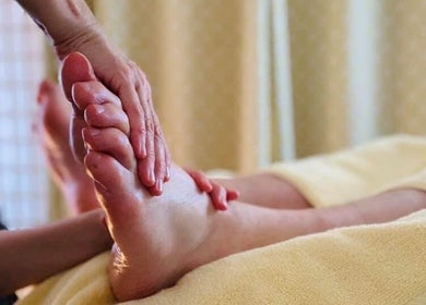 Relaxing foot massage at Marie Johnson Holistic Therapies in Crediton, England, GB. Experience soothing wellness.
