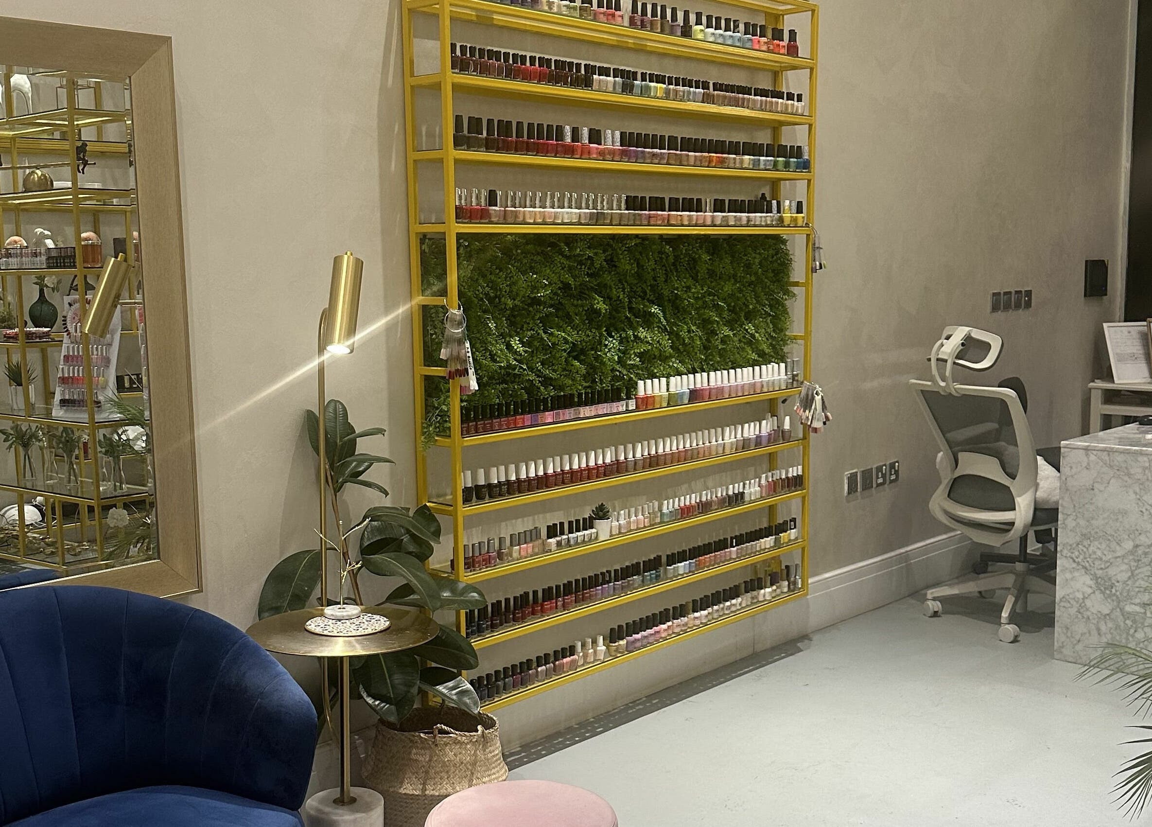 Elegant Naqa Nails interior showcasing colorful polish in Diriyah, Riyadh Province, SA.