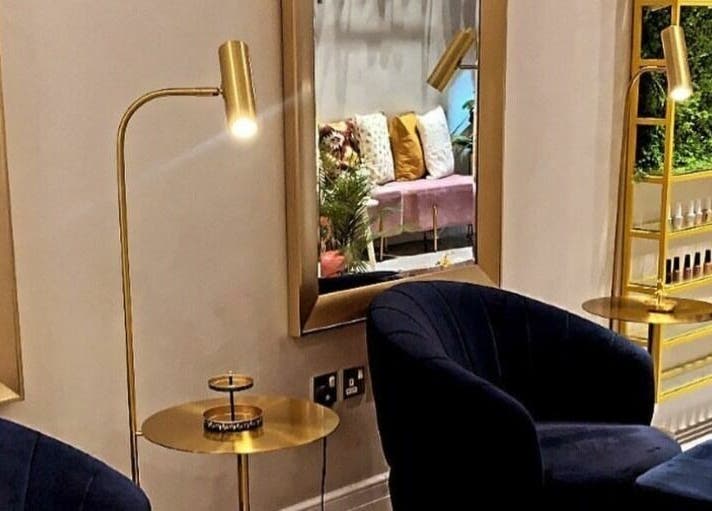 Elegant seating area with gold decor at Naqa Nails, Diriyah, Riyadh Province, SA.