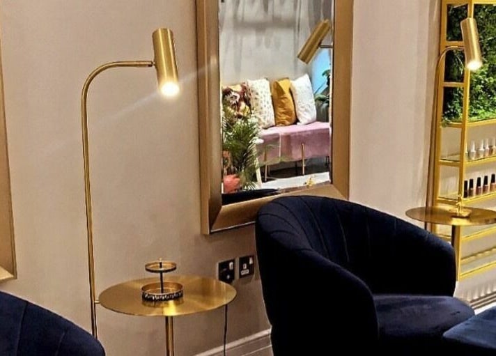 Elegant seating area with gold decor at Naqa Nails, Diriyah, Riyadh Province, SA.