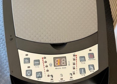 Close-up of micro-mist machine at SEVEN Hair Studio, London, England, GB, showcasing controls and settings.