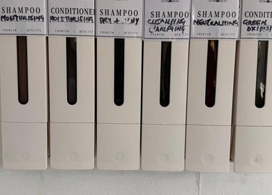 Selection of premium shampoos and conditioners at SEVEN Hair Studio in London, England, GB.