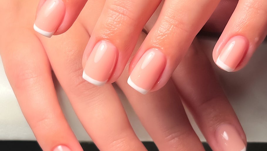Beautiful French manicure at Fleur’s Nails MK in Milton Keynes, England, GB, showcasing elegant nail art.