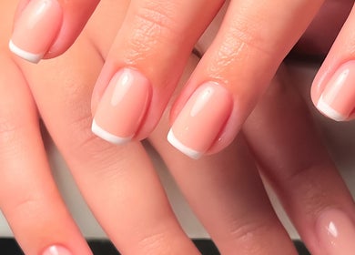 Beautiful French manicure at Fleur’s Nails MK in Milton Keynes, England, GB, showcasing elegant nail art.