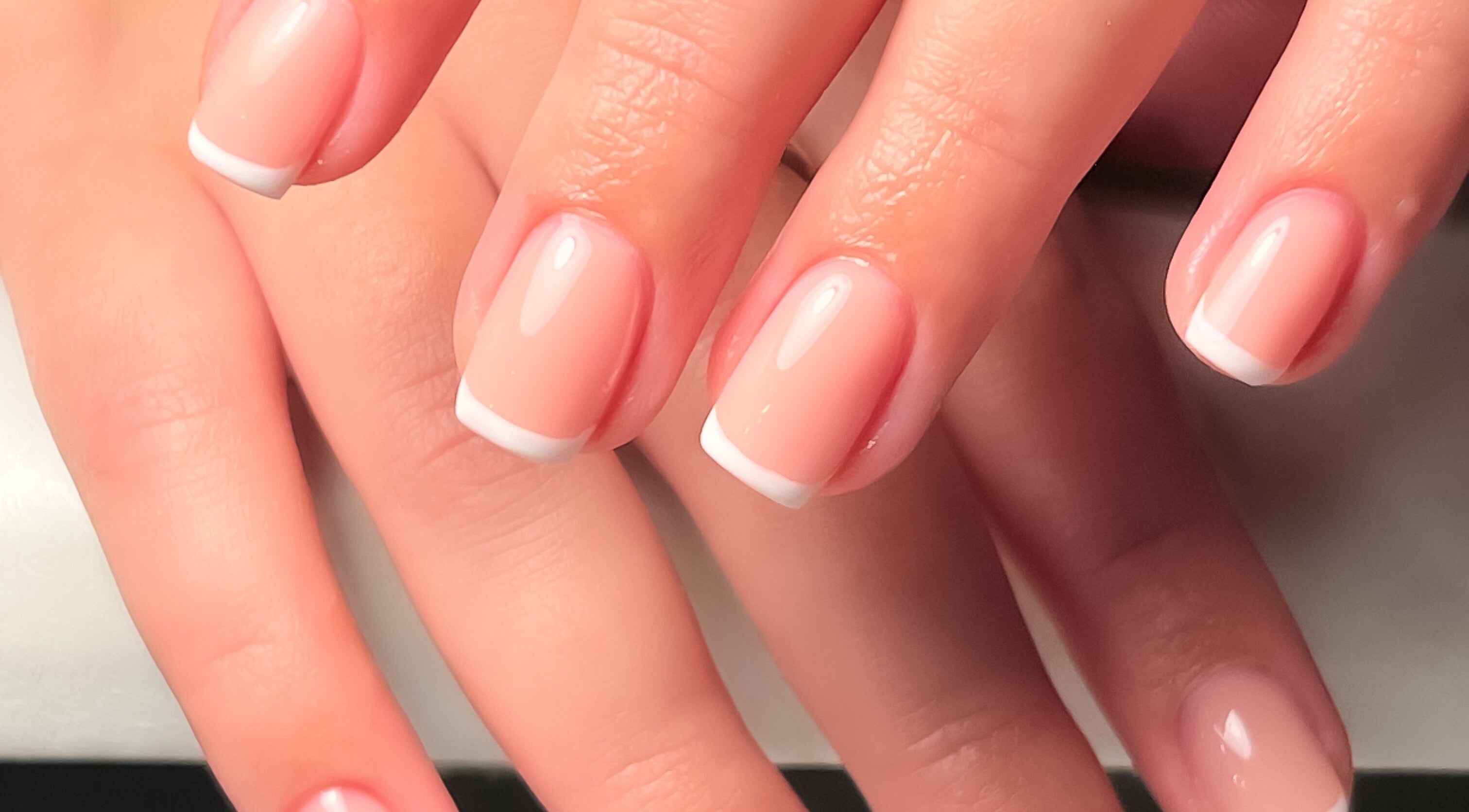 Beautiful French manicure at Fleur’s Nails MK in Milton Keynes, England, GB, showcasing elegant nail art.