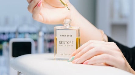 Nail treatment with cuticle oil at Fleur’s Nails MK, Milton Keynes, England, GB.