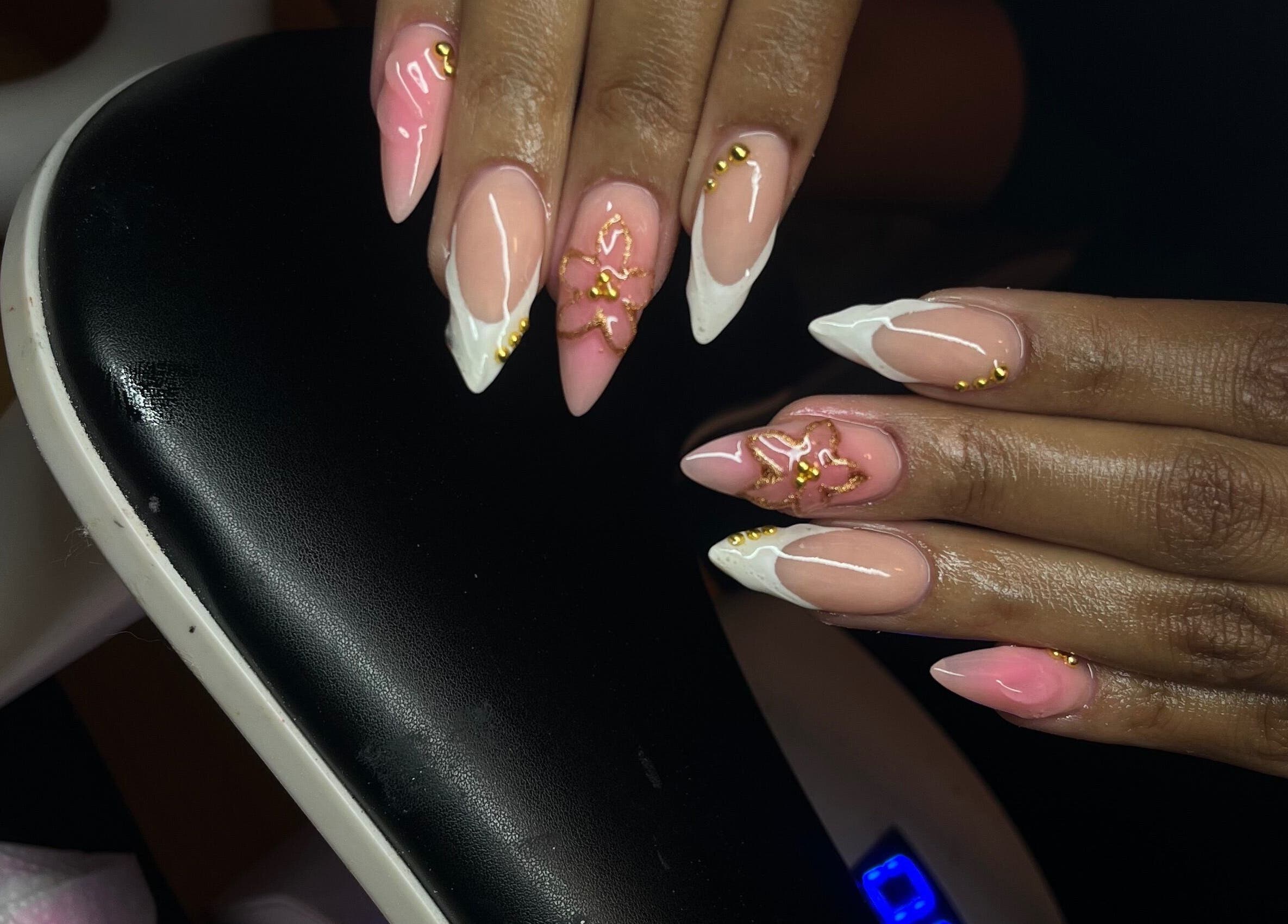 Elegant pink and white nail artistry at Nailsbykay in Centurion, Gauteng, ZA showcasing gold detailing.