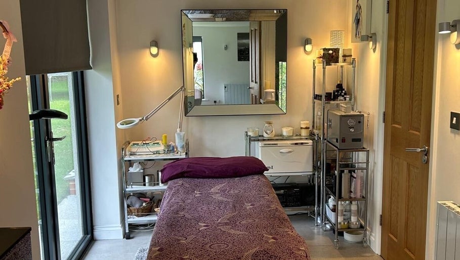 Relaxing treatment room at Eden Beauty, Oxford, England, GB featuring a comfortable massage bed and soothing decor.
