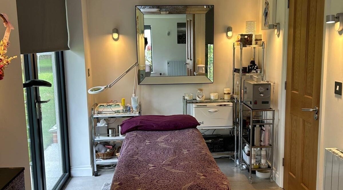 Relaxing treatment room at Eden Beauty, Oxford, England, GB featuring a comfortable massage bed and soothing decor.
