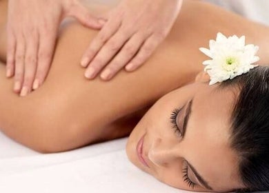 Relaxing massage at Organic Body Therapies, Christchurch, Canterbury, NZ with a white flower accent.