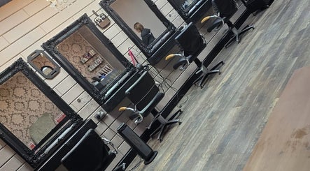 Elegant styling stations at The Hub Hair and Beauty, Sunderland, England, GB with ornate mirrors and chairs.