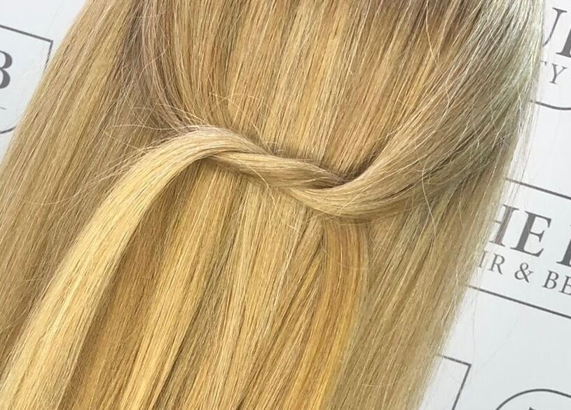 Blonde hair styled with a twist at The Hub Hair and Beauty, Sunderland, England, GB.