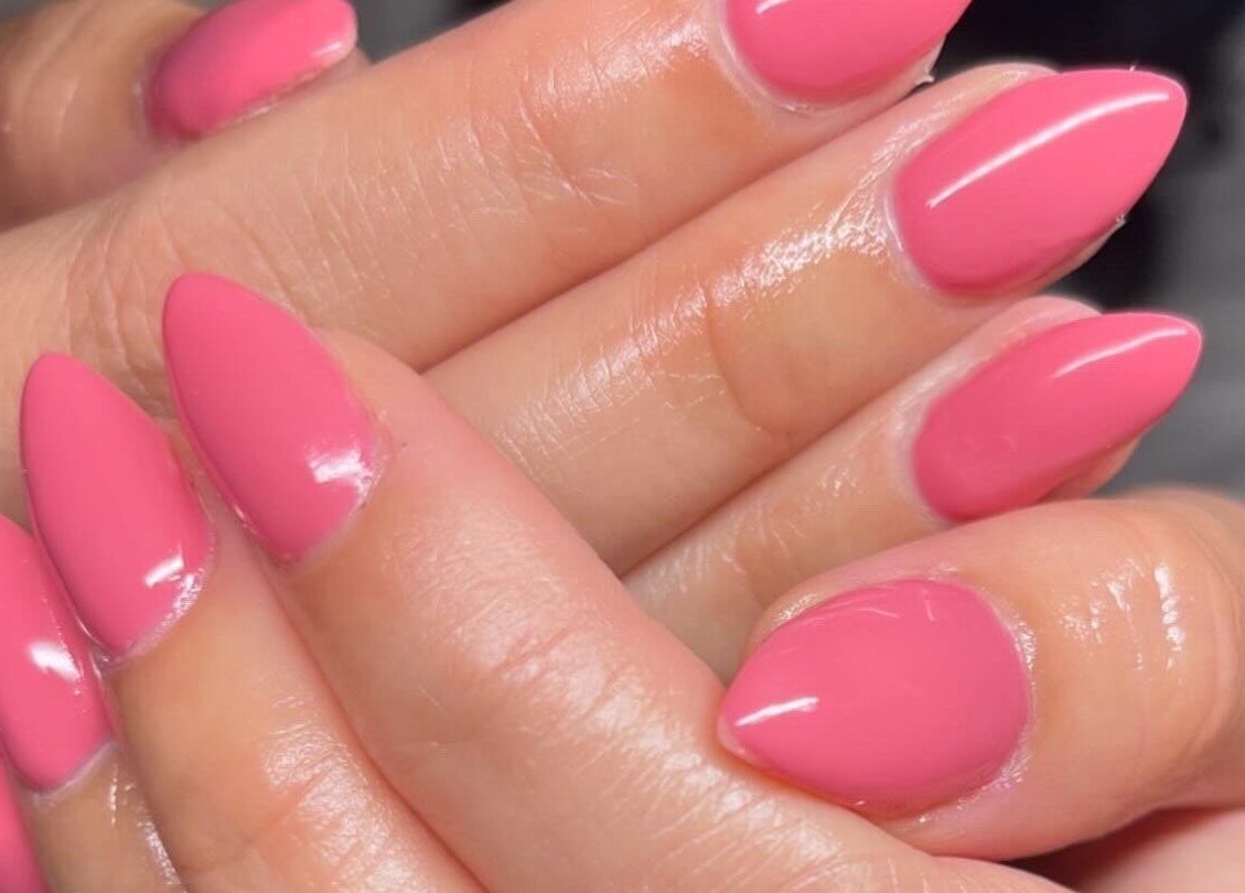 Stylish pink manicured nails at Clos Beauty, Peterborough, England, GB. Perfect for nail care lovers.
