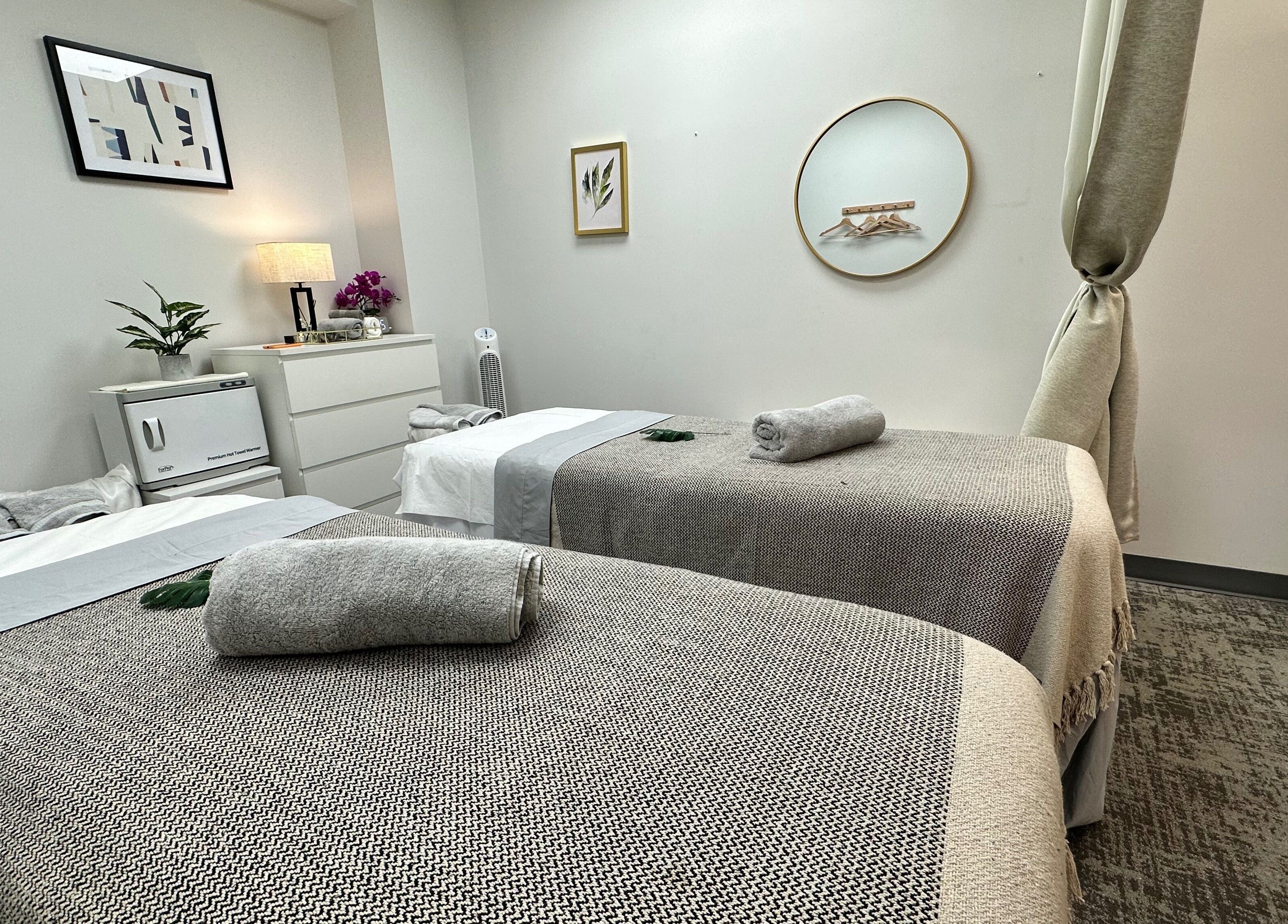 Serene spa room with massage tables at Union Thai Spa, New York, New York, US, offering ultimate relaxation.