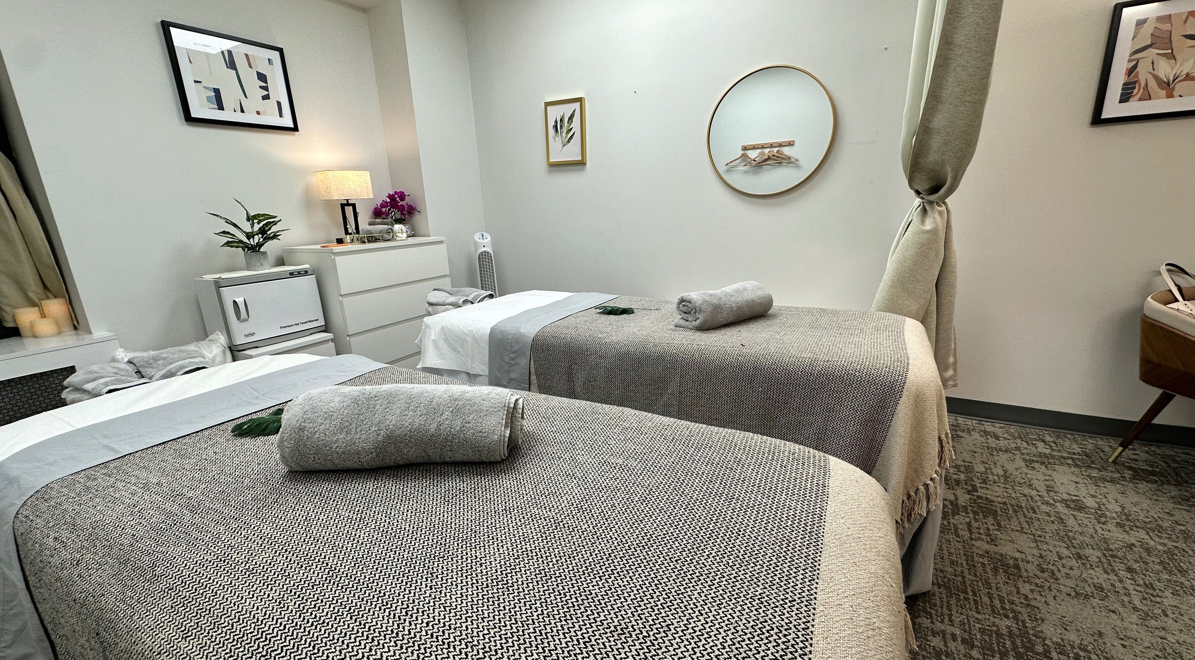 Serene spa room with massage tables at Union Thai Spa, New York, New York, US, offering ultimate relaxation.