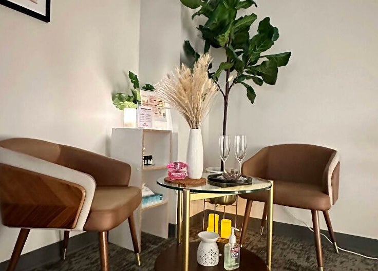 Relaxing seating area at Union Thai Spa, New York, New York, US, with modern chairs and decor.