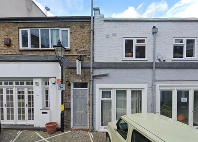 Front of Alice Pearl Somatics in London, England, GB. Brick facade with white-framed doors and windows.