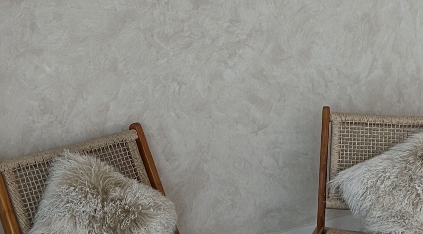 Elegant seating area at Hasana in Griffith, Australian Capital Territory, AU with stylish woven chairs and plush cushions.