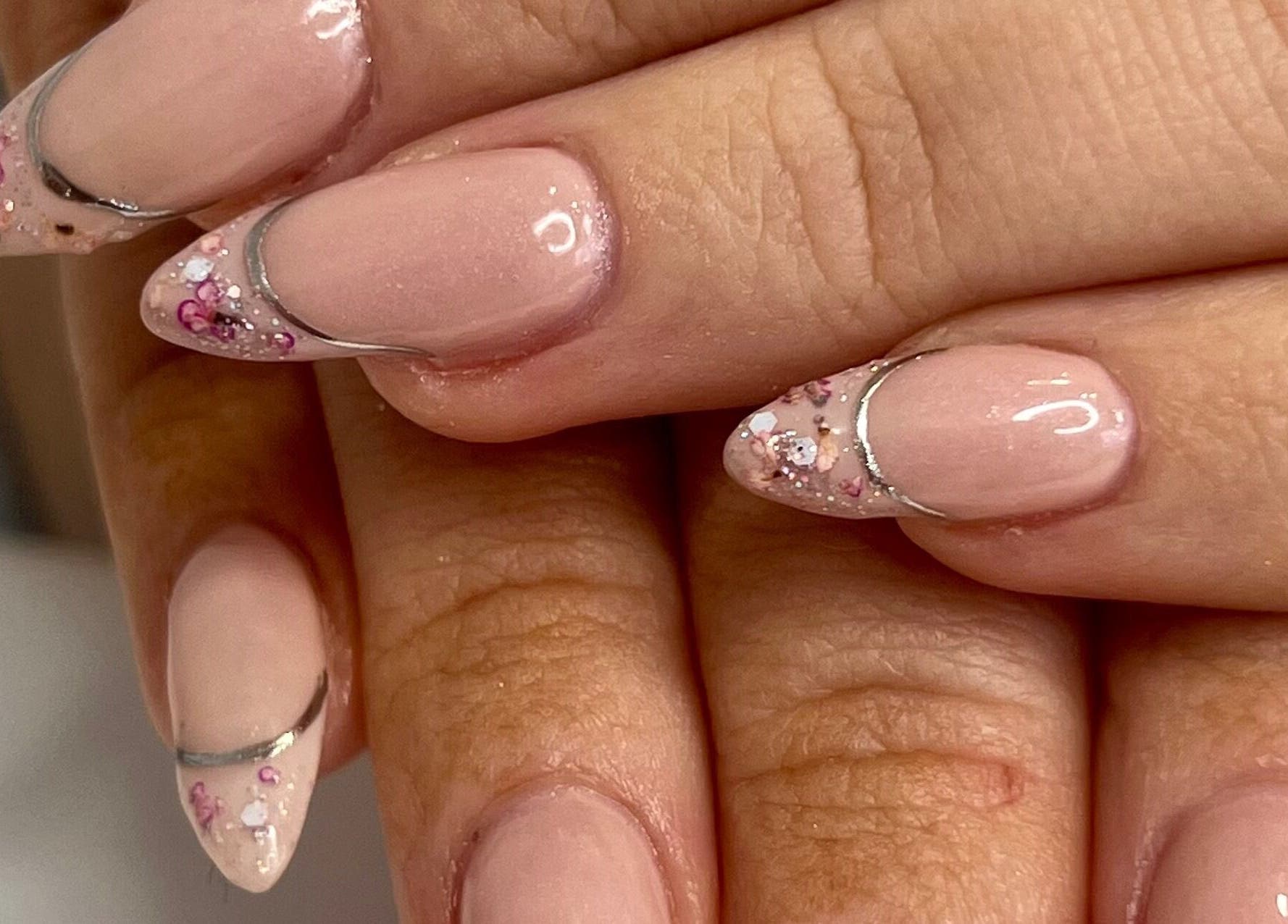 Elegant nail art with pink and silver designs at Hasana, Griffith, Australian Capital Territory, AU.