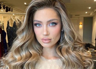 Elegant styling at Sirens Hair Extensions, Campsie, New South Wales, AU with luxurious curled hair.