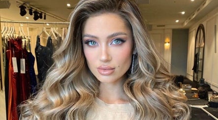 Elegant styling at Sirens Hair Extensions, Campsie, New South Wales, AU with luxurious curled hair.