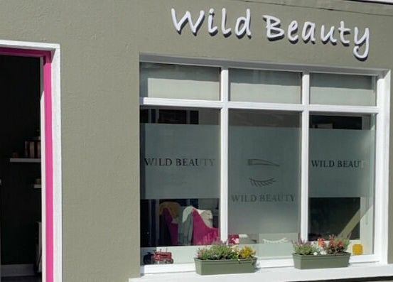 Front view of Wild Beauty in Clifden, County Galway, IE showcasing elegant windows and signage.