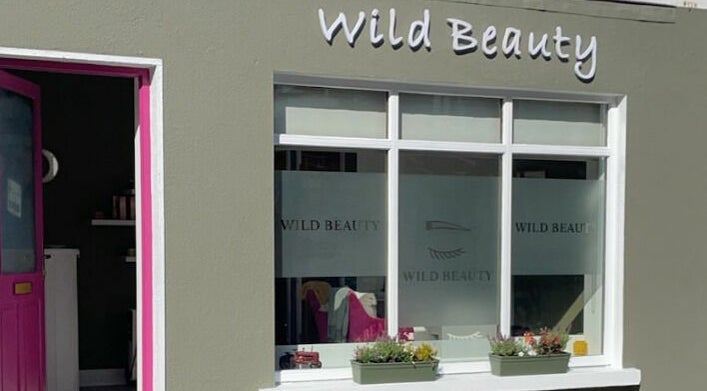 Front view of Wild Beauty in Clifden, County Galway, IE showcasing elegant windows and signage.