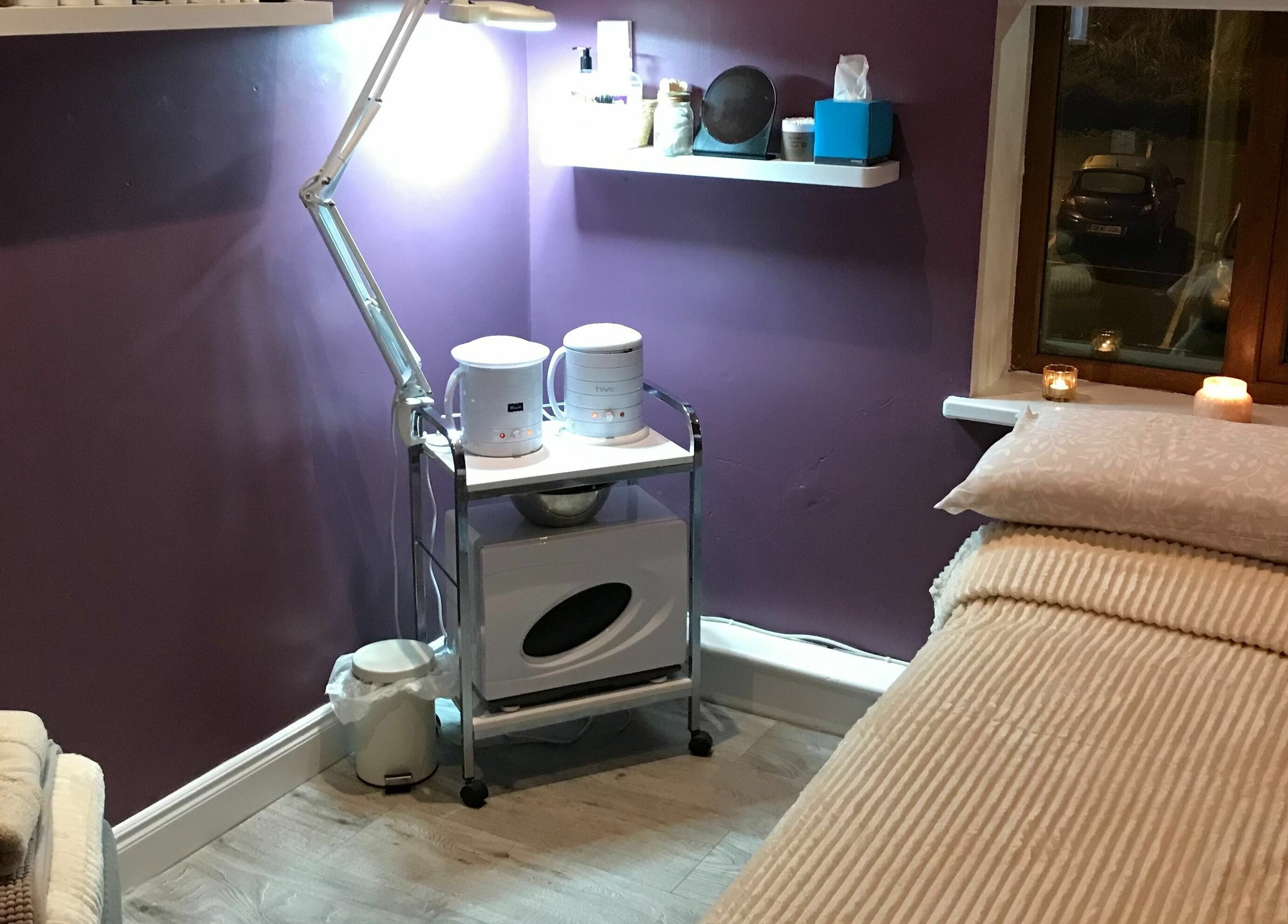 Cozy treatment room at Wild Beauty, Clifden, County Galway, IE with a treatment bed and soothing lighting.