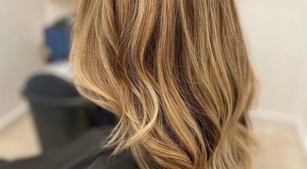 Lustrous golden hair styled at CURA, Trail, British Columbia, CA. Perfect for elegant beauty transformations.